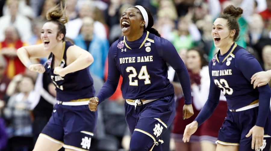 COLUMBUS, OH - APRIL 01:  Arike Ogunbowale #24 of the Notre Dame Fighting Irish is congratulated by her teammates Marina Mabrey #3 and Kathryn Westbeld #33 after scoring the game winning basket with 0.1 seconds remaining in the fourth quarter to defeat the Mississippi State Lady Bulldogs in the championship game of the 2018 NCAA Womens Final Four at Nationwide Arena on April 1, 2018 in Columbus, Ohio. The Notre Dame Fighting Irish defeated the Mississippi State Lady Bulldogs 61-58.  (Photo by Andy Lyons/Getty Images)