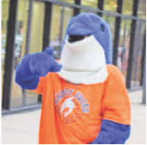 Flip the Dolphin, Whitney Young Mascot, extends a fin invitingly.