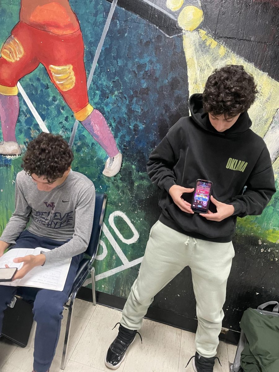 Caught in the Clash: Junior Oren Epstein, pictured above, swaps schoolwork for the thrill of mobile games like Clash Royale.